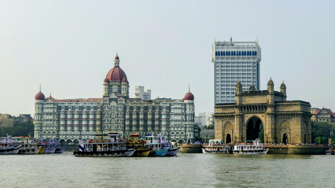 a body of water with boats and buildings along it